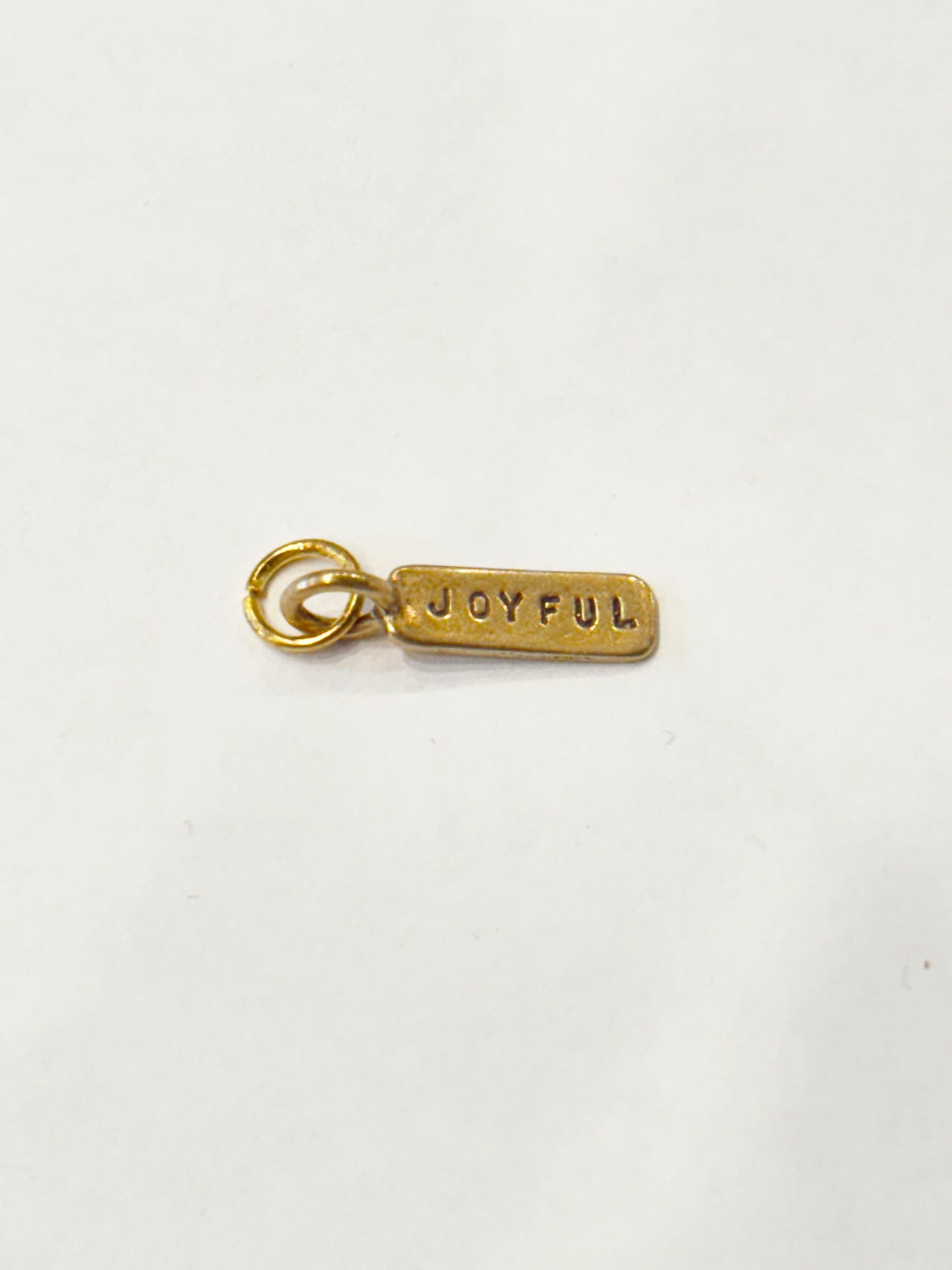 BRONZE JOYFUL TAG CHARM