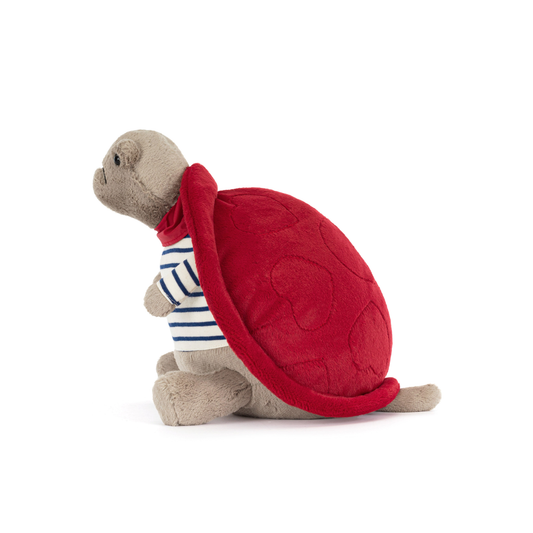 side view of Plush grumpy turtle with red shell, red necktie and blue and white stripped top on a white background