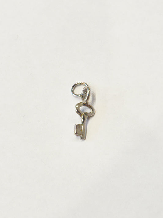 TINY SILVER KEY CHARM