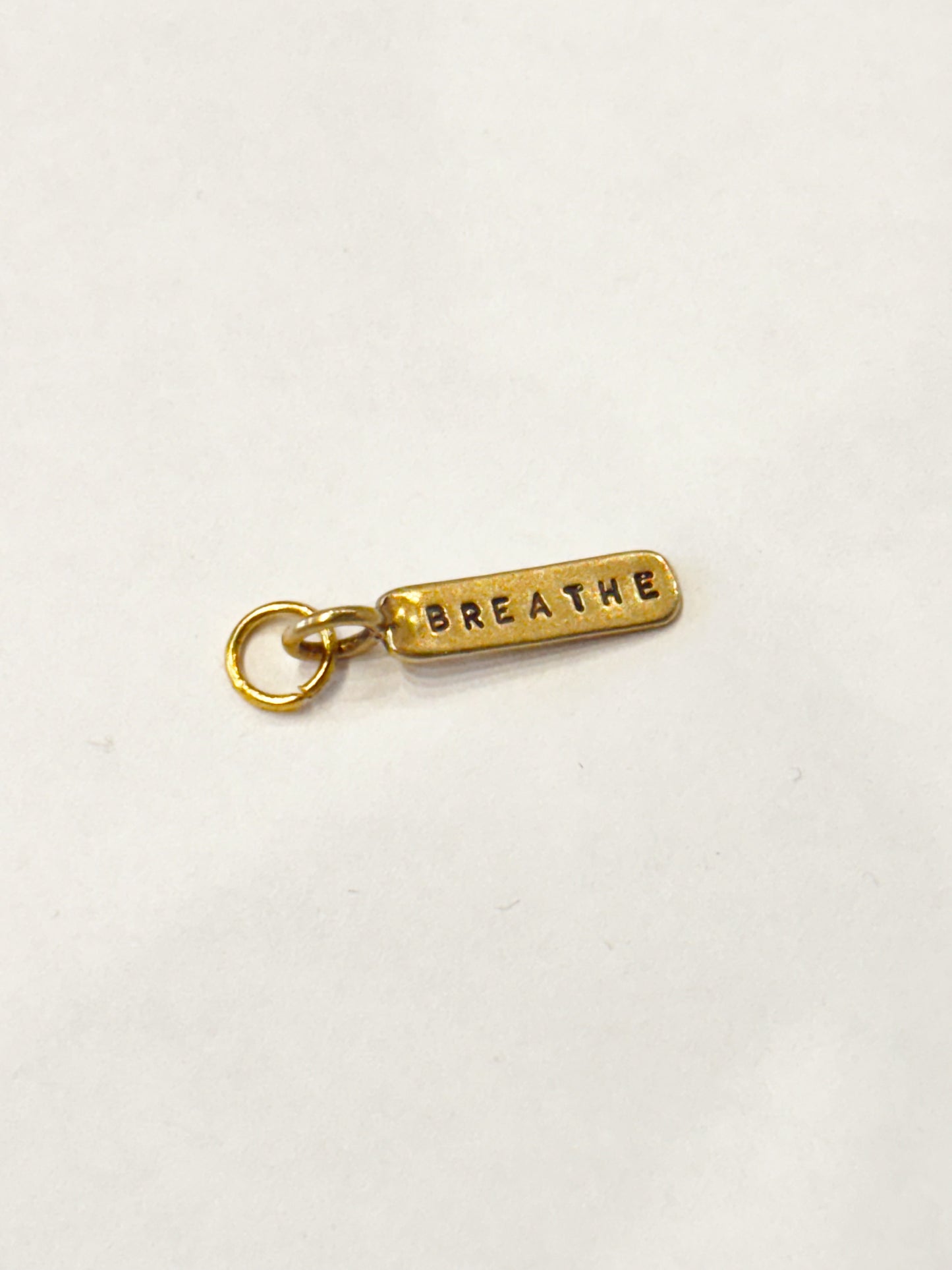 BRONZE BREATHE TAG CHARM